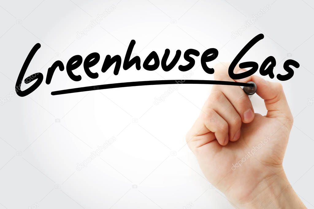 Hand writing Greenhouse gas with marker