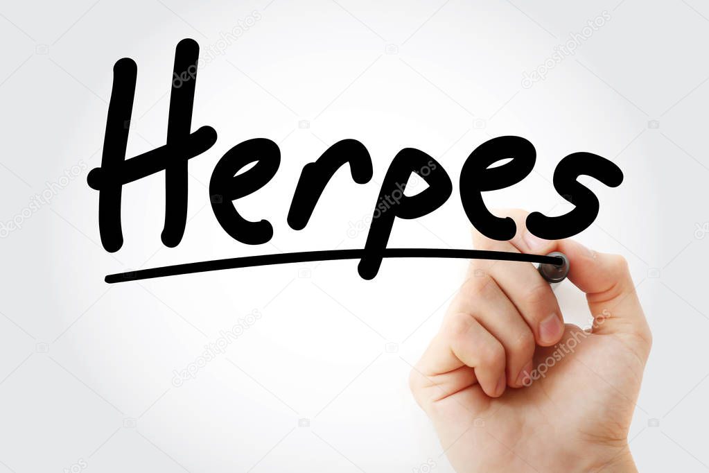 Hand writing Herpes with marker
