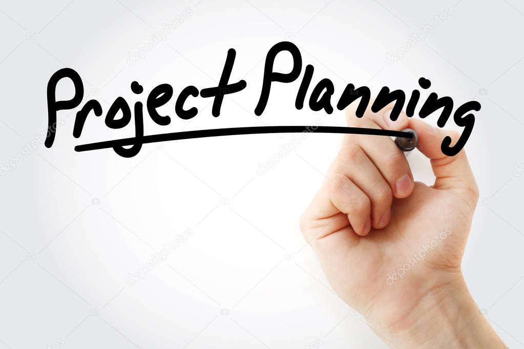 Hand writing project planning with marker