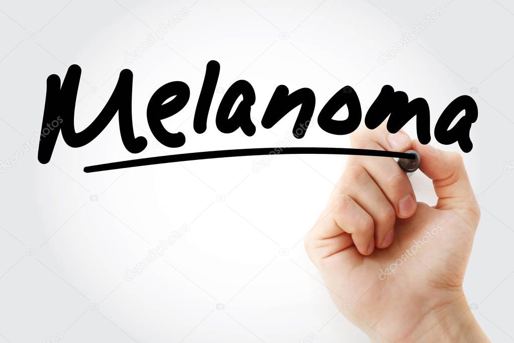 Hand writing Melanoma with marker