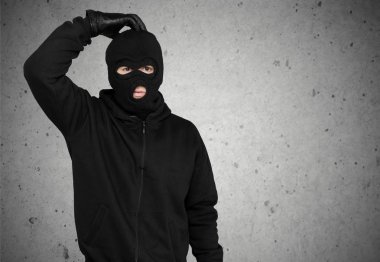 man thief in black balaclava clipart