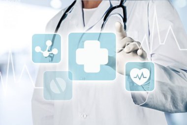 Tıbbi simge ve genç doktor 