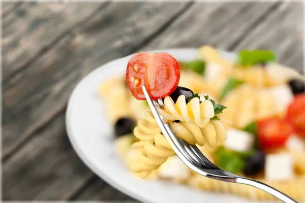 Penne rigate pasta på en gaffel — Stockfoto