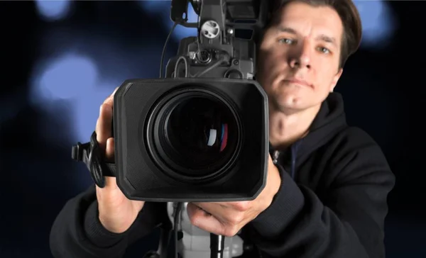 Cameraman met zijn camera — Stockfoto