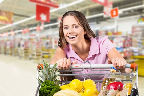 Woman with cart shopping — Stock Photo, Image