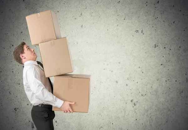 Lots of cardboard boxes and man — Stock Photo, Image