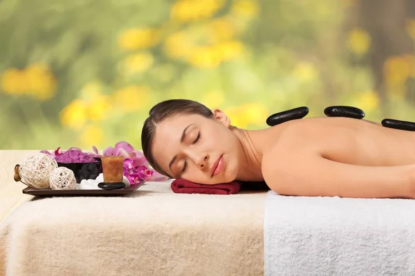 Woman relaxing with massage — Stock Photo, Image