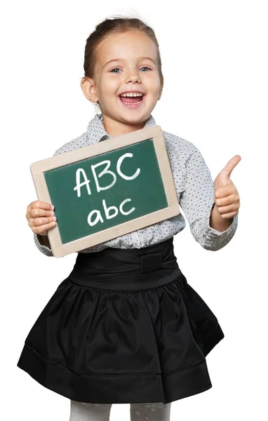 Söt liten skolflicka med blackboard — Stockfoto