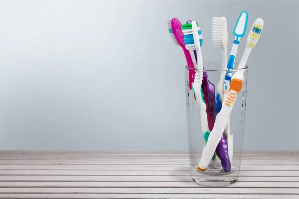 New Colorful Toothbrushes in  Glass — Stock Photo, Image