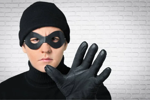 Kwaad crimineel in een masker — Stockfoto