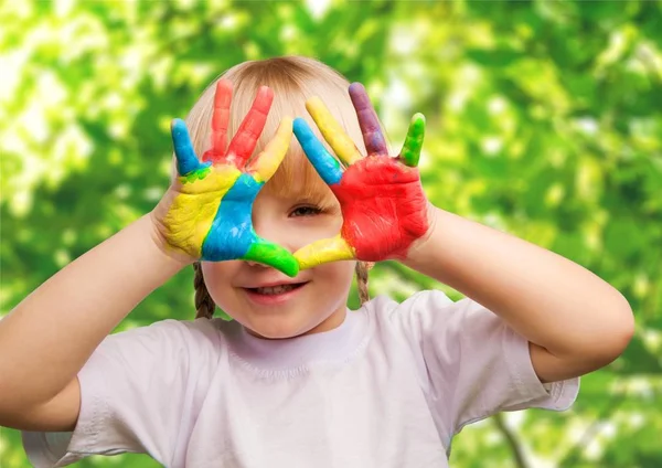 Little girl with colorful painted hands — Stock Photo, Image