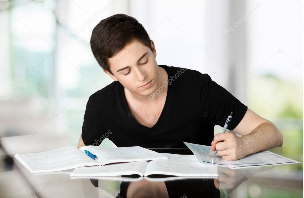 Handsome Teenager studying
