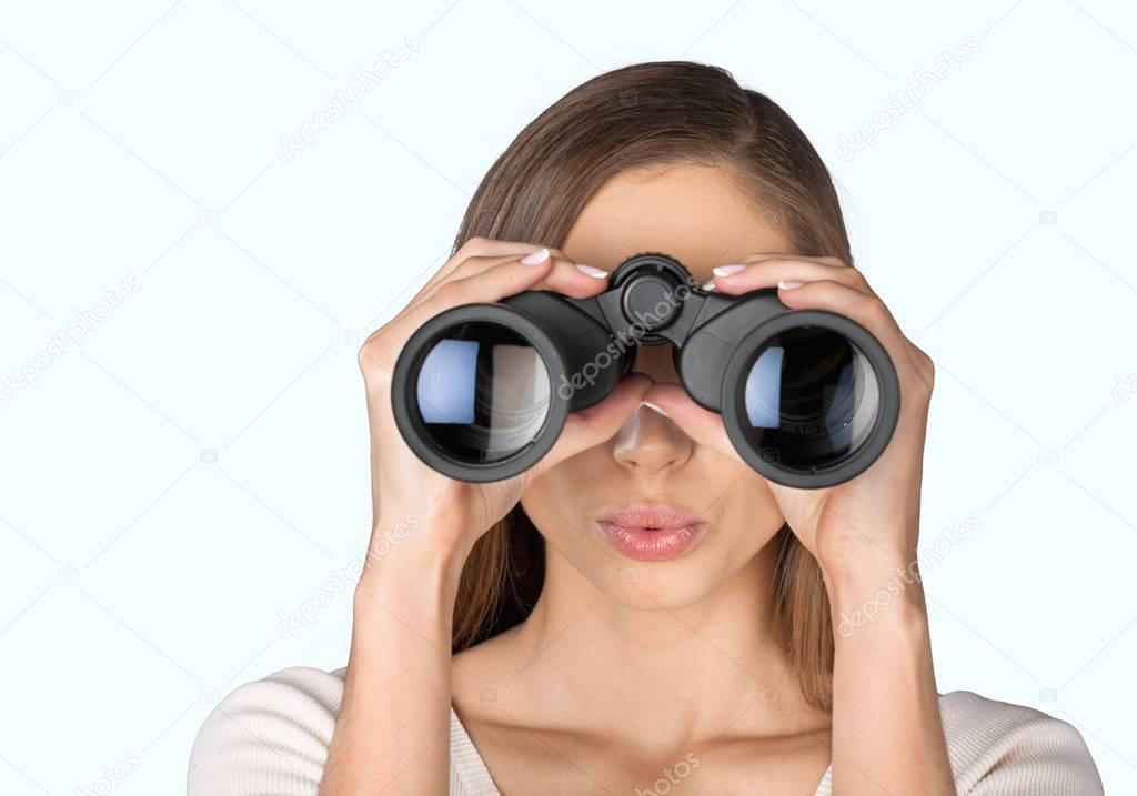 Girl looking into binoculars