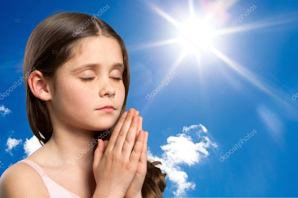 Cute Little girl praying Stock Photo by ©billiondigital 129205396