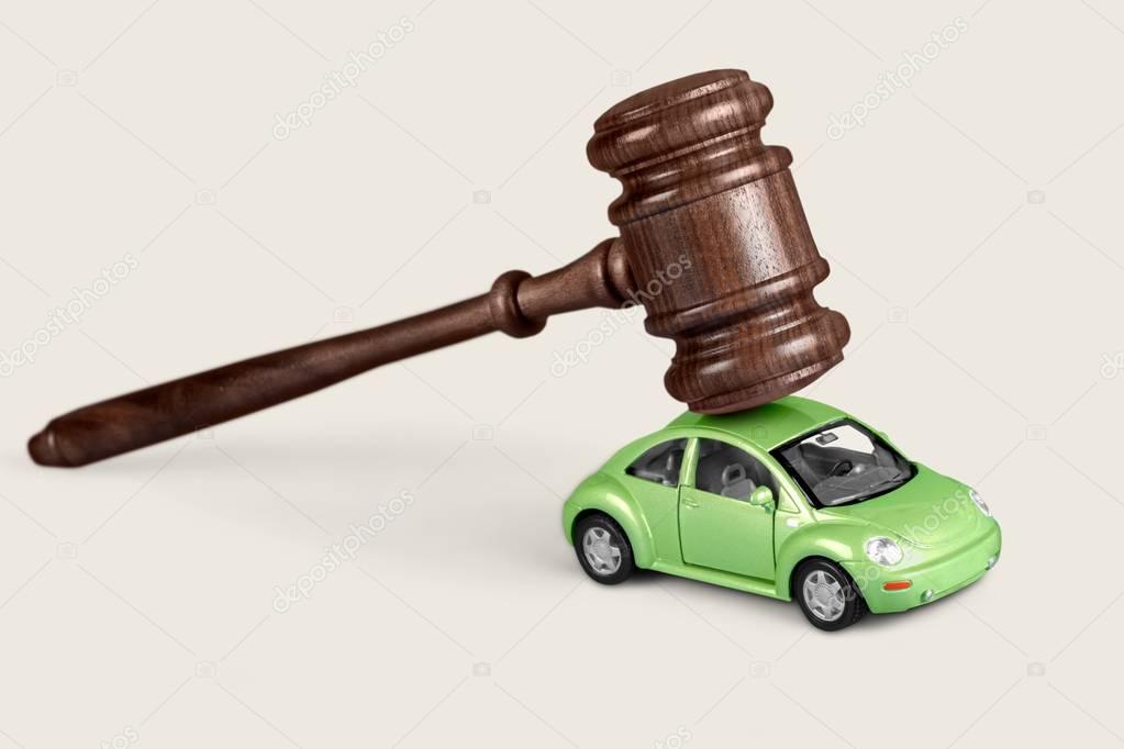 wooden gavel with car 