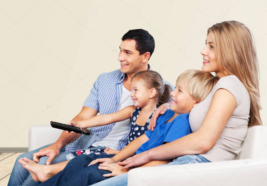 Beautiful Lovely family watching tv 
