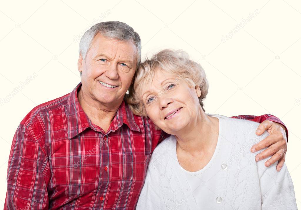 happy senior couple smiling at home
