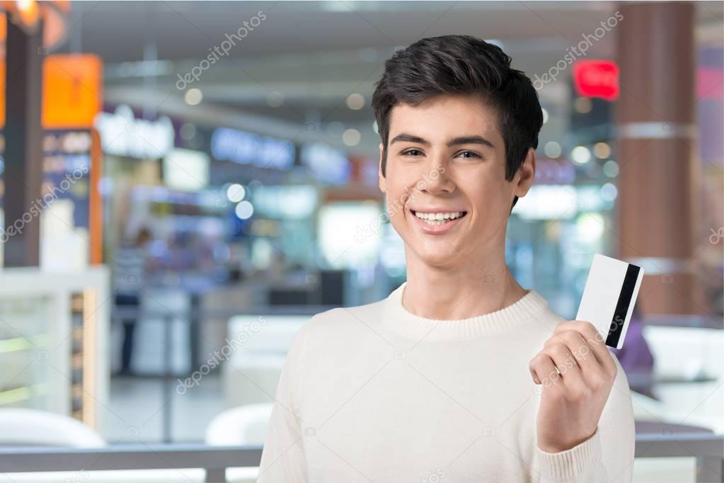 Handsome Teenager with credit card
