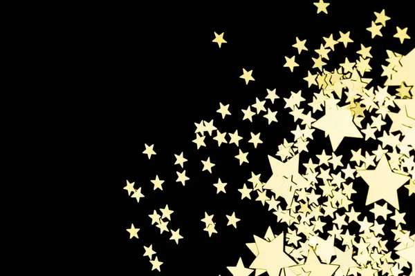 Gouden sterren in de vorm van confetti — Stockfoto