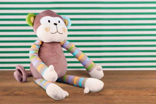 Macaco brinquedo macio sentado — Fotografia de Stock