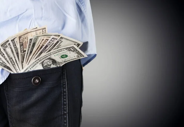 Businessman with money in pocket — Stock Photo, Image