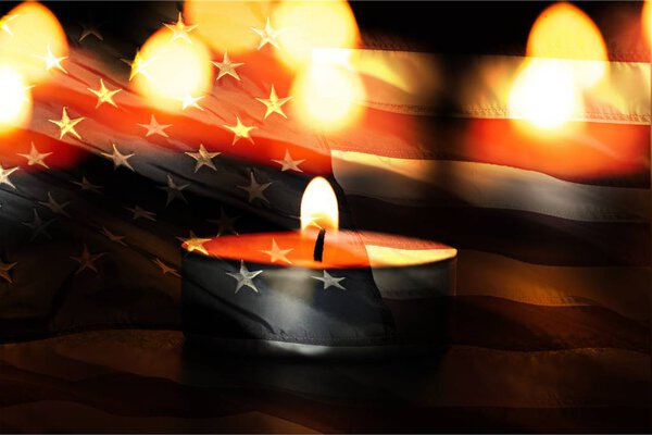 candle  in front of an American US flag