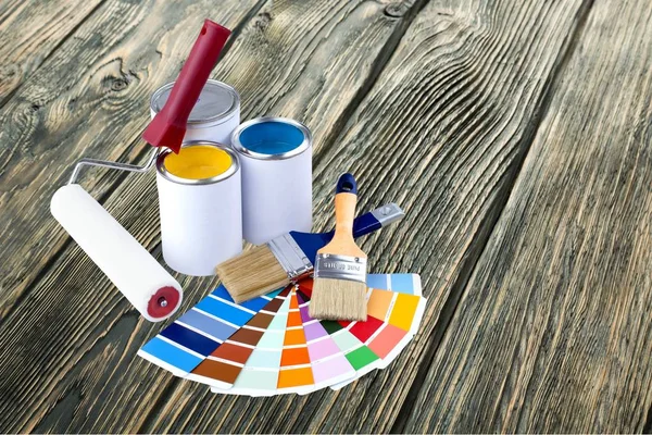 Paint brushes and paint cans — Stock Photo, Image