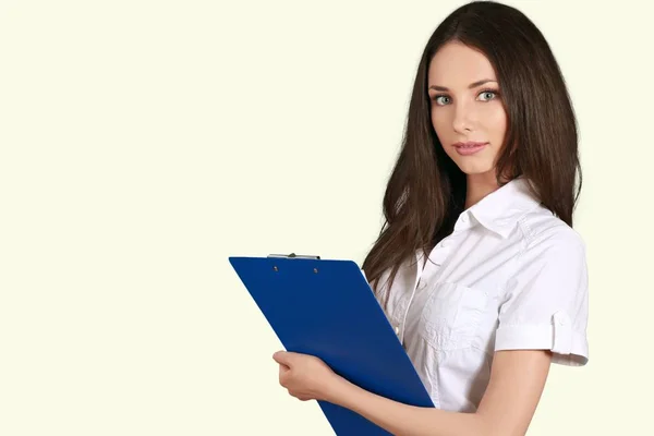 Beautiful young woman with clipboard — Stock Photo, Image