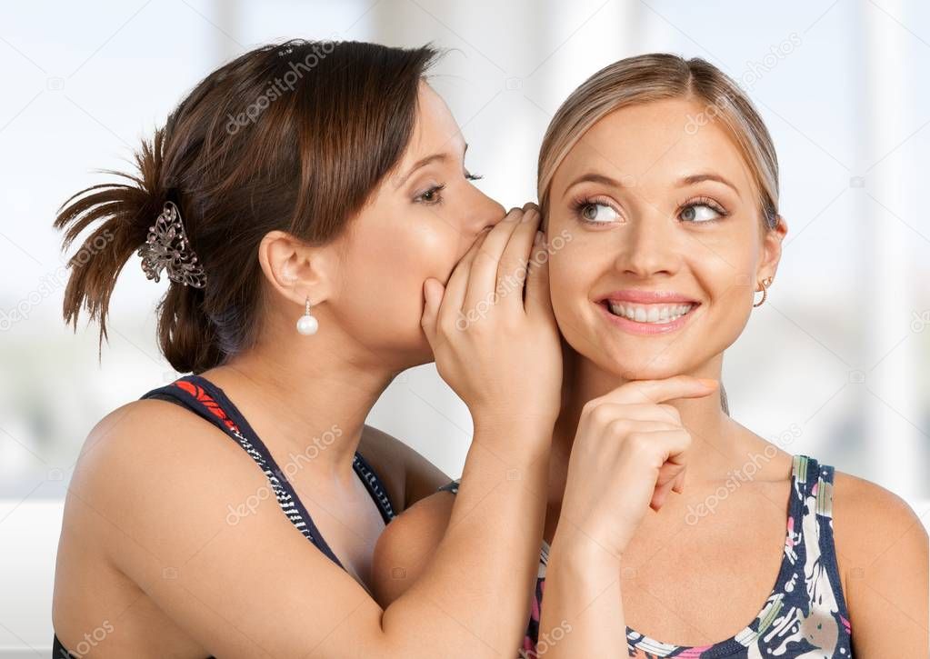 Woman revealing secret to friend 
