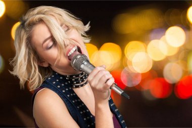  stylish woman singing karaoke  clipart