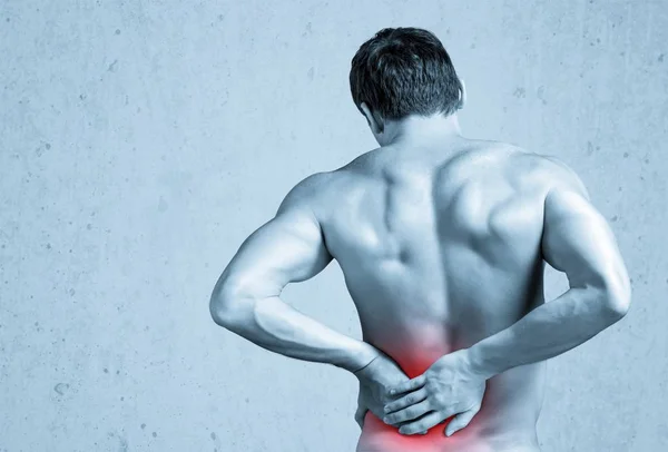 Homem forte com dor nas costas — Fotografia de Stock