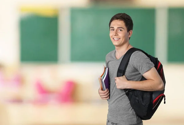 Sorrindo menino bonito com cadernos — Fotografia de Stock