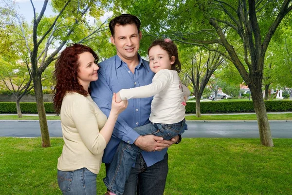 Happy smiling family with daughter — Stock Photo, Image