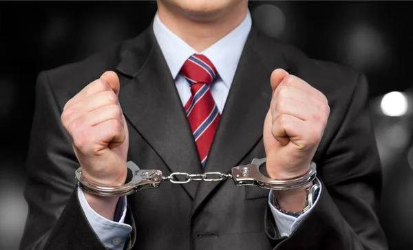 Man in handcuffs behind his back — Stock Photo, Image