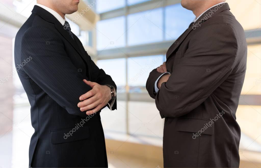 Businessmen in Business Suits with Crossed Arms