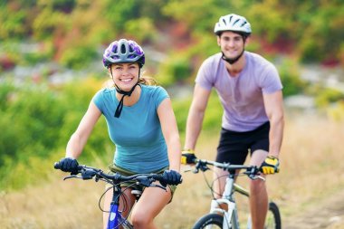  happy couple riding bicycle outdoors clipart