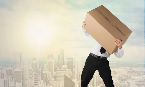 stressed businessman with box
