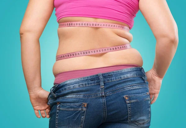 Fat woman measuring her stomach — Stock Photo, Image