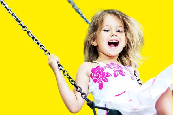 Little girl having fun on swing — Stock Photo, Image