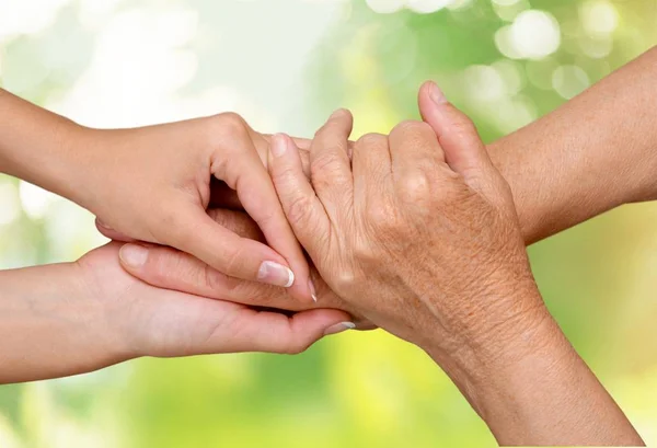 Old and young hands — Stock Photo, Image