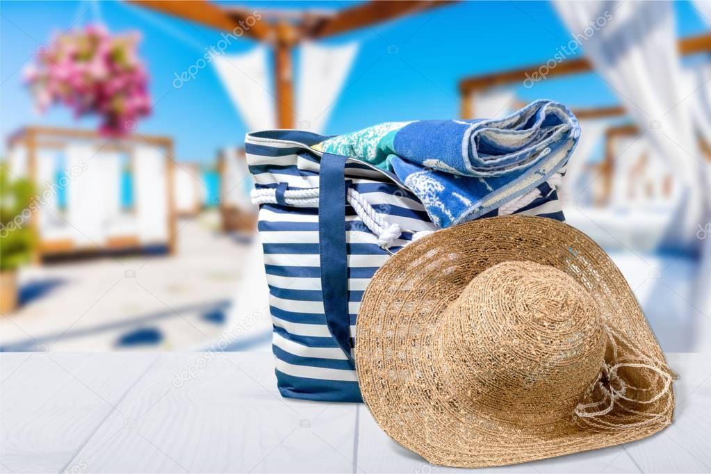 beach bag with a straw hat sun