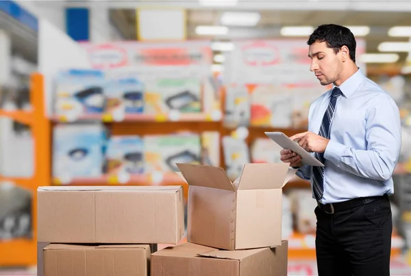 Business man with boxes — Stock Photo, Image