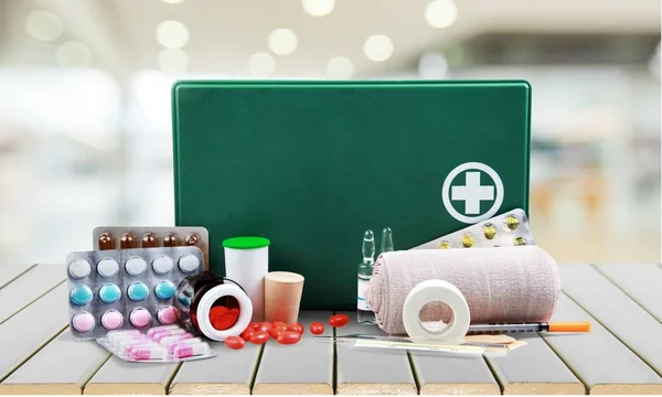 First aid kit  with medical supplies — Stock Photo, Image