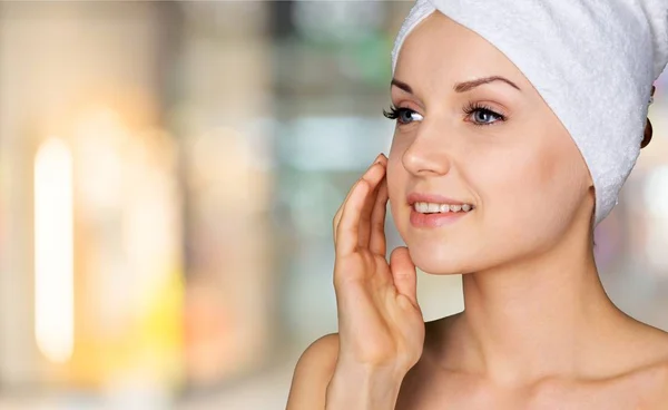 Young woman with towel on head — Stock Photo, Image