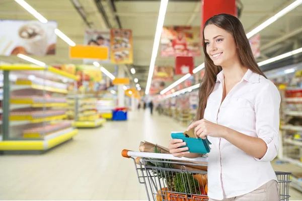 Woman with cart shopping — Stock Photo, Image