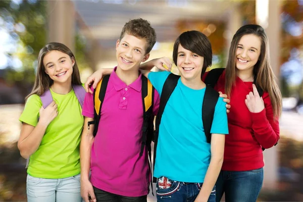Friendly school children with backpacks — Stock Photo, Image