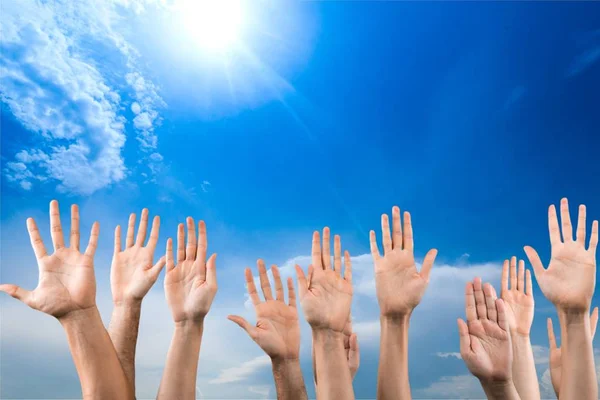 Human hands on blue sky — Stock Photo, Image