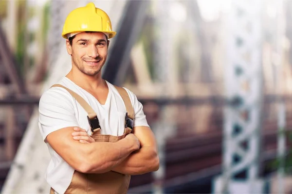 Hombre en uniforme de trabajo y casco —  Fotos de Stock