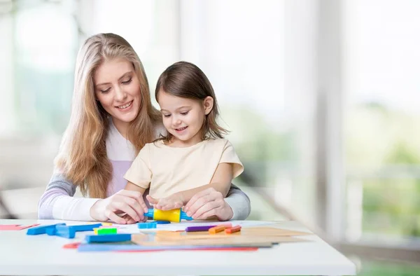 Mother and daughter drawing Royalty Free Stock Images