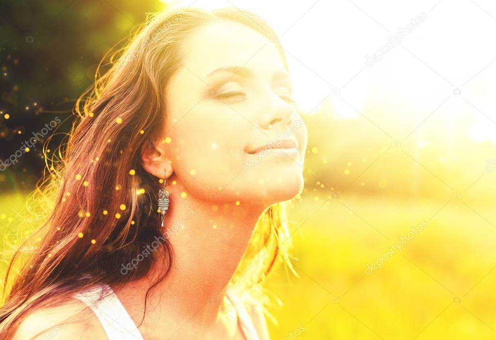 Woman under sunset light